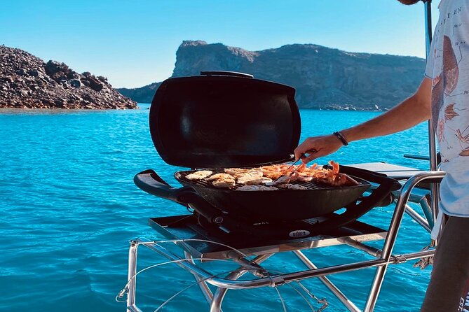 half-day-exclusive-catamaran-cruise-in-santorini-with-meal-and-open-bar