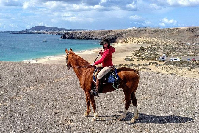 horseback-riding-in-the-sunset-of-famara-beach-lanzarote-spain