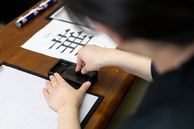 learning-zen-of-japanese-calligraphy-in-kimono-near-osaka-castle