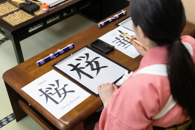 learning-zen-of-japanese-calligraphy-in-kimono-near-osaka-castle