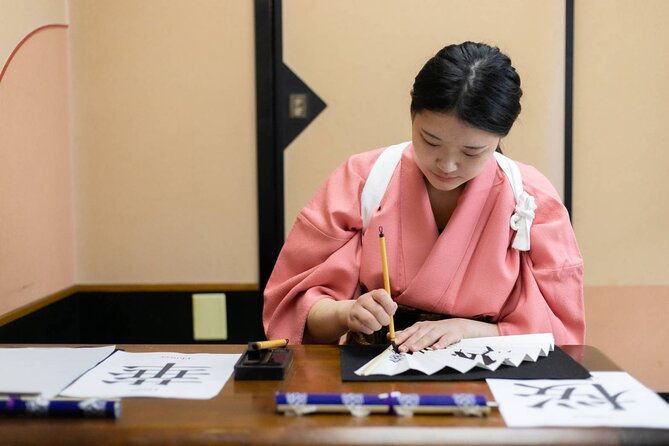 learning-zen-of-japanese-calligraphy-in-kimono-near-osaka-castle