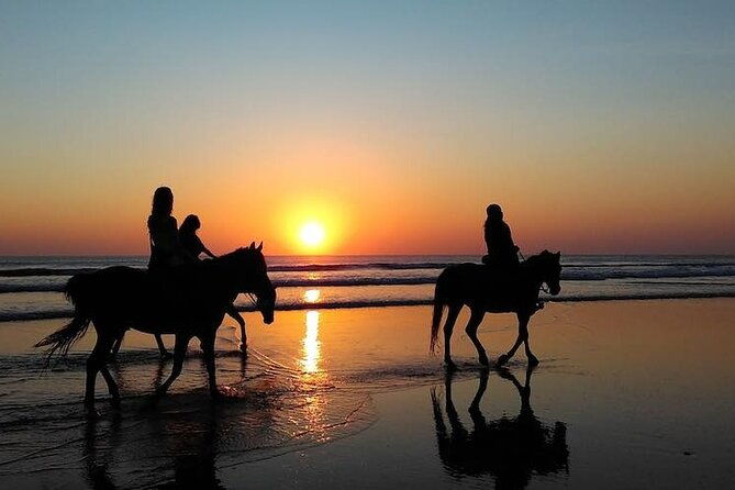horseback-riding-in-the-sunset-of-famara-beach-lanzarote-spain