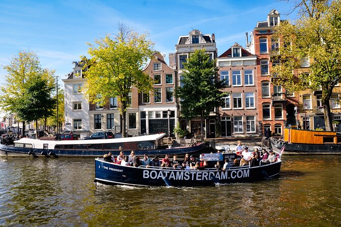 open-boat-canal-cruise-in-old-city-centre-of-amsterdam