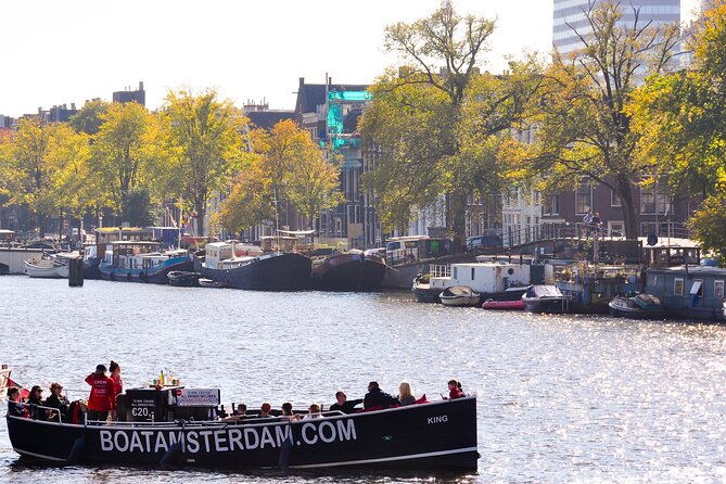 open-boat-canal-cruise-in-old-city-centre-of-amsterdam-2