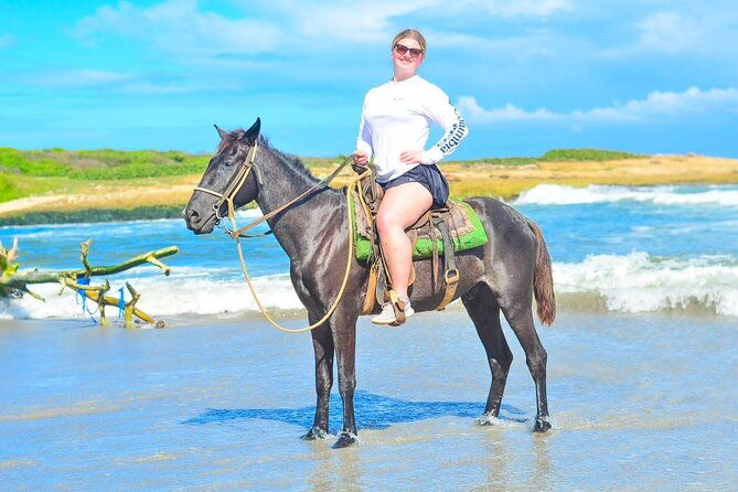 horseback-riding-along-macao-beach-with-transportation