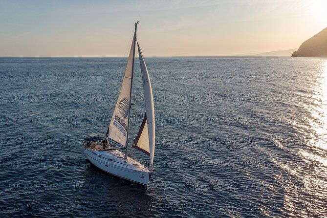 sunset-sailing-along-the-cliffs-of-maro-private