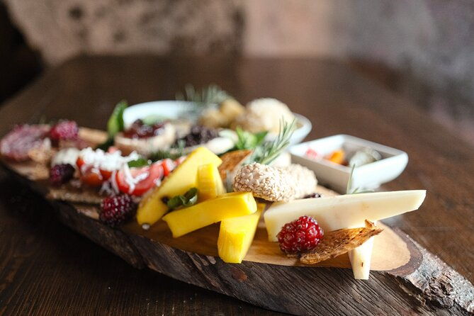 etna-urban-winery-tasting-with-street-food-platter-and-vineyard
