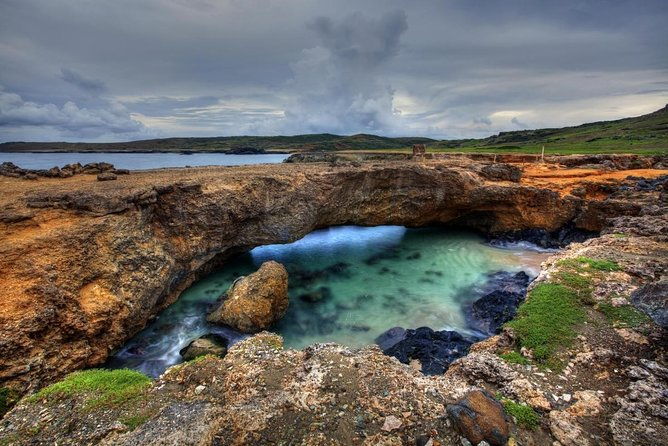 sunrise-hike-with-private-guide-to-natural-bridge-north-coast