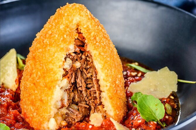 course-of-arancini-and-almond-paste-in-catania