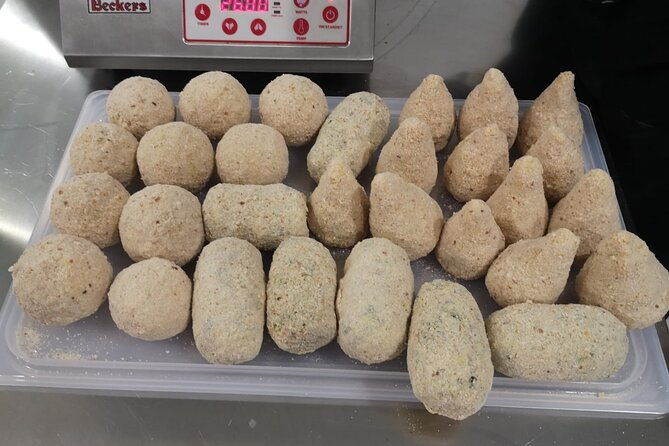 course-of-arancini-and-almond-paste-in-catania