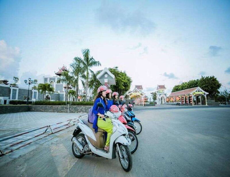 danang-night-city-scooter-tour-lady-aodai-rider-han-cruise