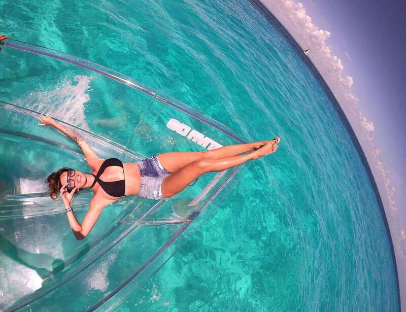 explore-the-sea-of-cozumel-in-a-transprent-boat-with-drinks-and-snorkel