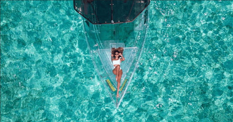explore-the-sea-of-cozumel-in-a-transprent-boat-with-drinks-and-snorkel