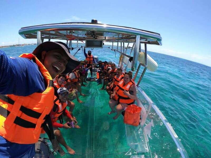 snorkeling-in-cozumel-waters-in-a-transparent-boat-beers