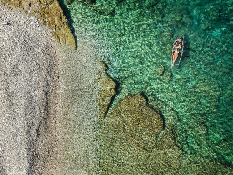 pula-clear-kayak-tour-to-canyon-island-cliffs-small-cave