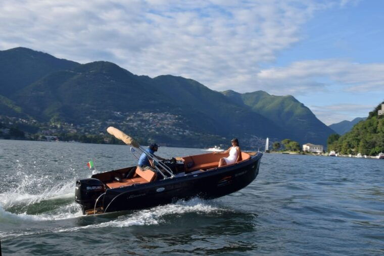 lake-como-boat-ride-with-an-elegant-black-boat