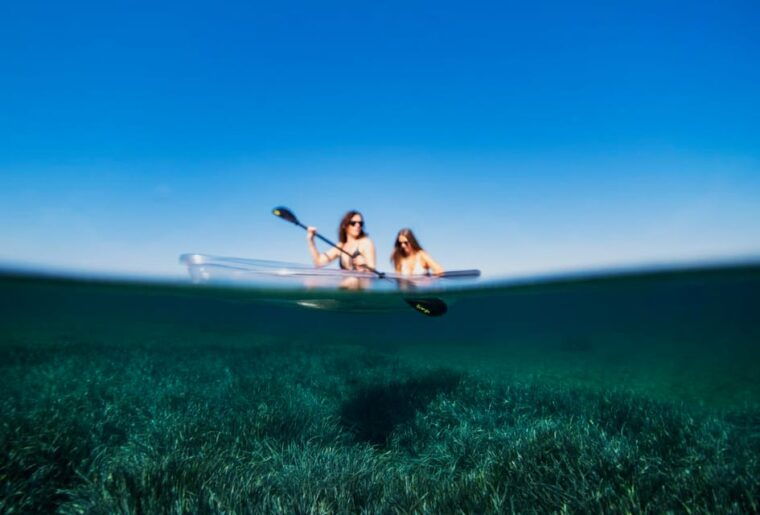 pula-clear-kayak-tour-to-canyon-island-cliffs-small-cave