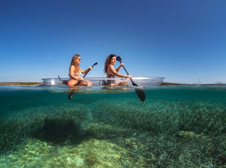 pula-clear-kayak-tour-to-canyon-island-cliffs-small-cave
