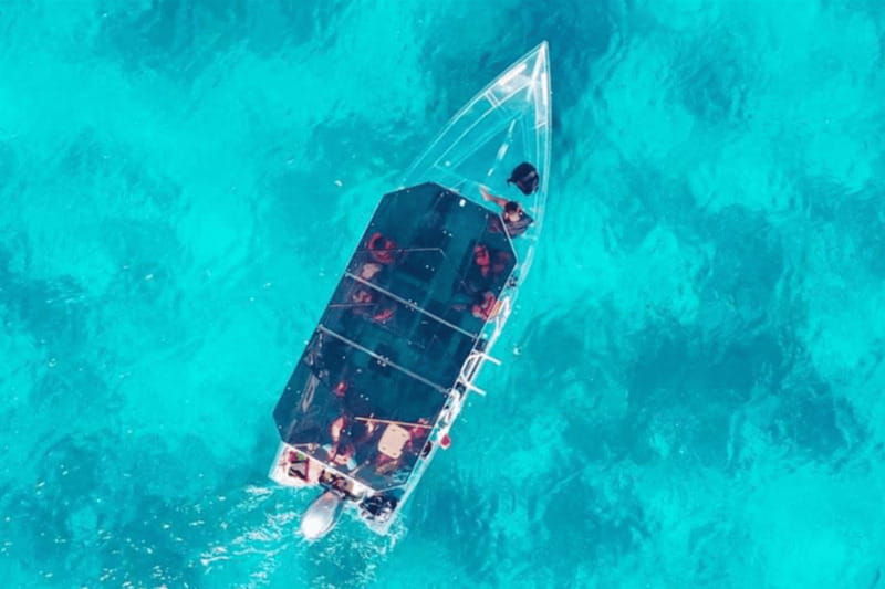 explore-the-sea-of-cozumel-in-a-transprent-boat-with-drinks-and-snorkel