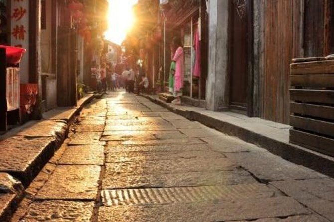 Private Fengjing and Xitang Water Town Sunset Boating Tour with Dinner from Shanghai - What to Expect in Terms of Experience and Logistics