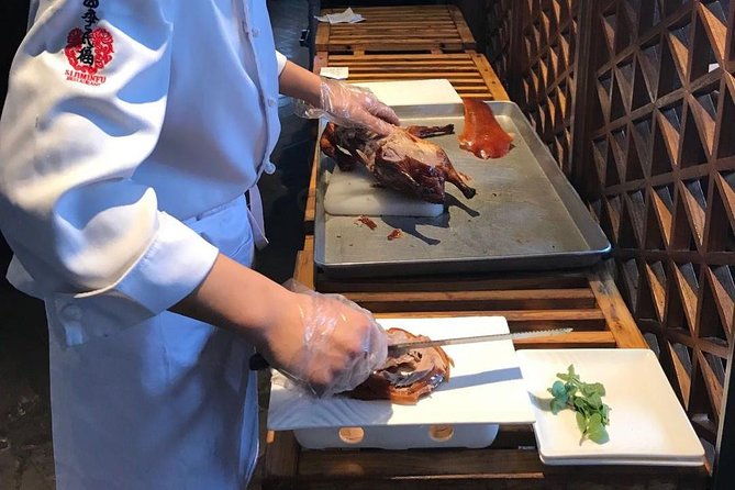 Private Tour to Pearl Market Acrobatic Show & Peking Duck Dinner - Frequently Asked Questions