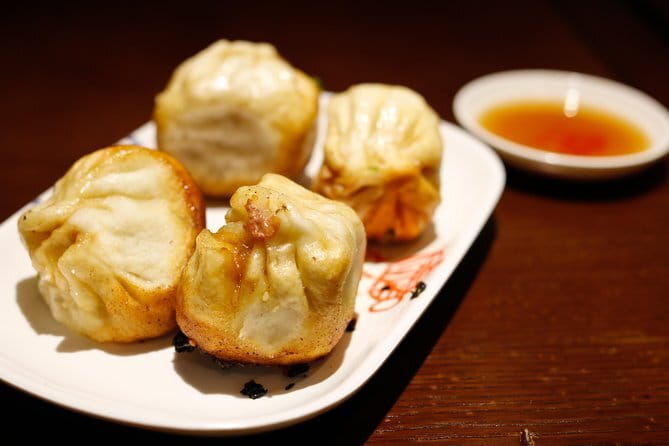 Shanghai Dusk Tour of the River, History Museum and Dinner - Enjoying a Local Dinner in Pudong