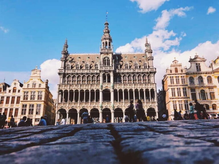 Brussels Highlights: Walking & Bus Tour with Waffle Tasting - Detailed breakdown of each stop