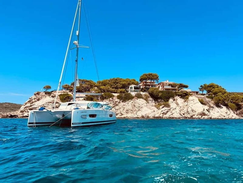 From Palma: Luxury Catamaran Group Tour with Tapas & Drinks - The Atmosphere and Crew