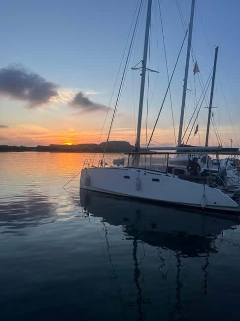 La pelosa: Sunset catamaran tour with aperitif