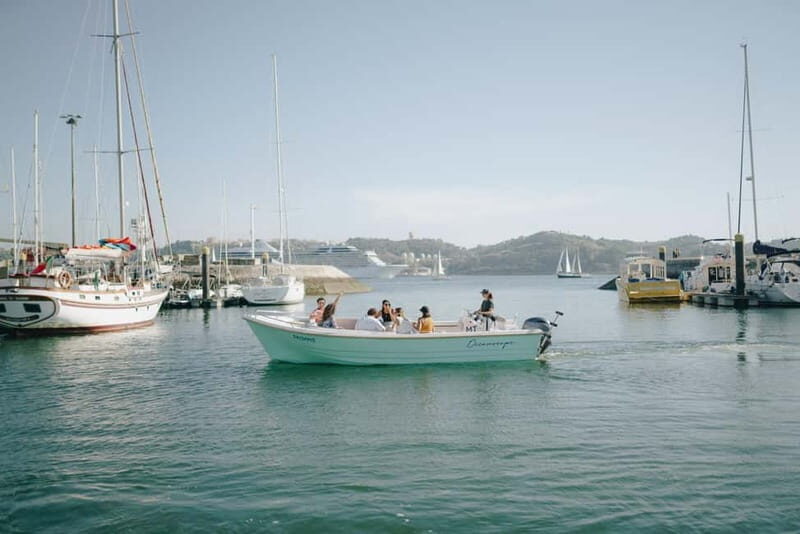 Lisbon Sunset Boat Tour with local Snacks & Drinks - The Vessel and Crew: Comfort and Knowledge