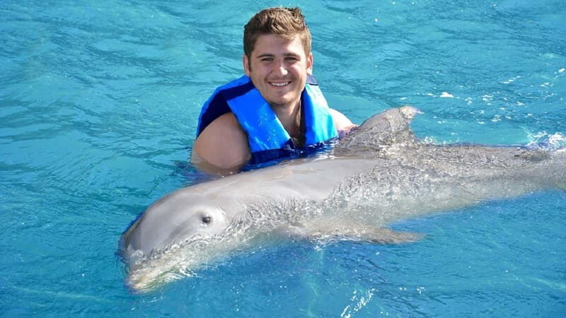 Cancún: Dolphin Encounter on Isla Mujeres with Buffet - Transportation, Duration, and Practical Tips