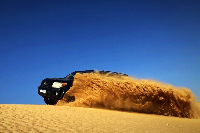 Desert Safari Dubai with BBQ - dinner, Sandboarding - The Bedouin-Inspired Camp and BBQ Dinner