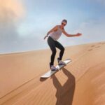 Dubai: Desert Safari With Quad Bike, Camel Ride & Dinner - Sandboarding and Photo Opportunities