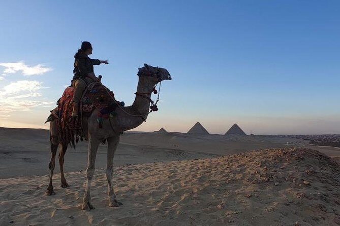 sunset at Giza pyramids by camels - The Camel Ride: A Scenic Highlight
