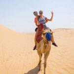 Dubai: Red Dunes Quad Bike with Sandboarding, Camels and BBQ - Authentic Experiences, Guided by Experts