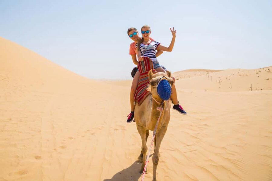 Dubai: Red Dunes Quad Bike with Sandboarding, Camels and BBQ - Authentic Experiences, Guided by Experts