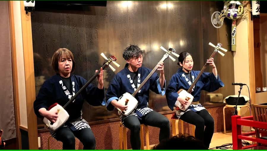 Tsugaru shamisen performance over traditional dinner - The Culinary Experience: Traditional Japanese Dinner