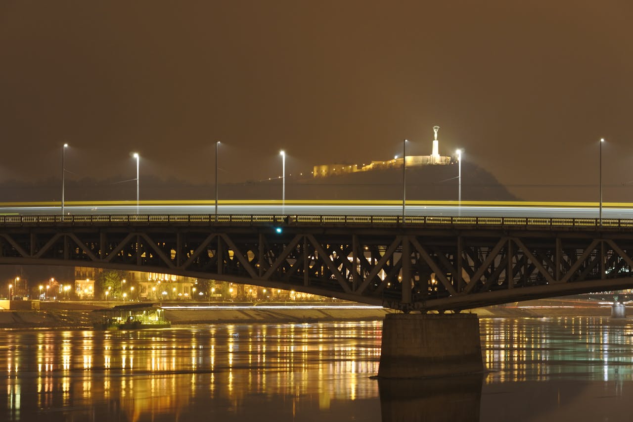 The Hungarian Parliament Building illuminated at night reflected in the Danube River