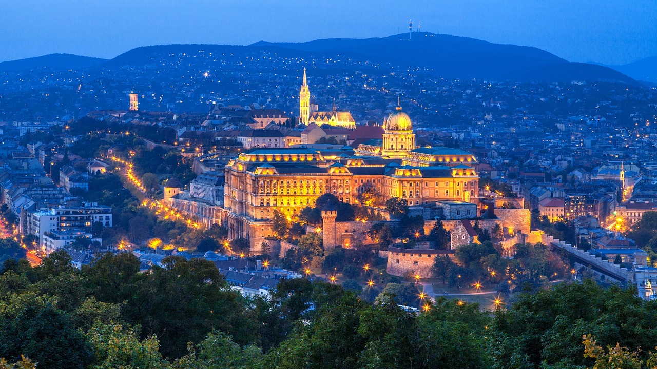 Buda Castle and the Chain Bridge illuminated at night in Budapest