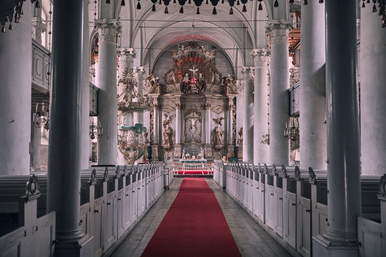 A grand Budapest church illuminated at night with warm exterior lighting