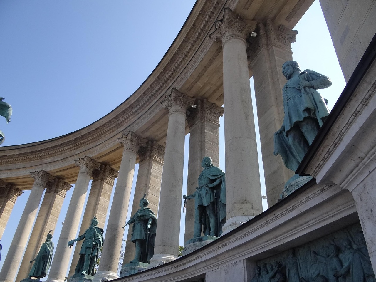 A Budapest street scene near St Stephens Basilica with pedestrians and historic buildings