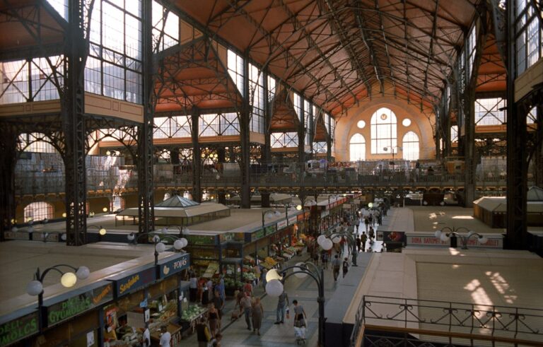 Interior of Budapest Great Market Hall with vendors and shoppers browsing