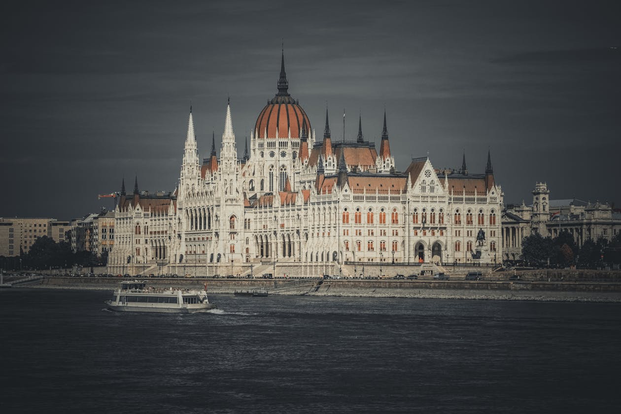 The Hungarian Parliament Building at sunset along the Danube River in Budapest