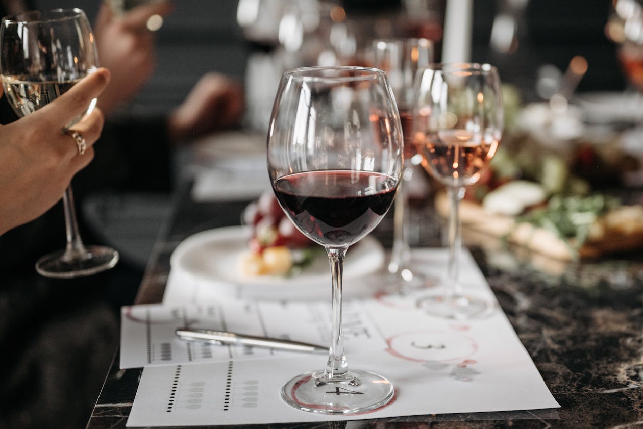 Close-up of wine glasses on a table during a wine tasting event