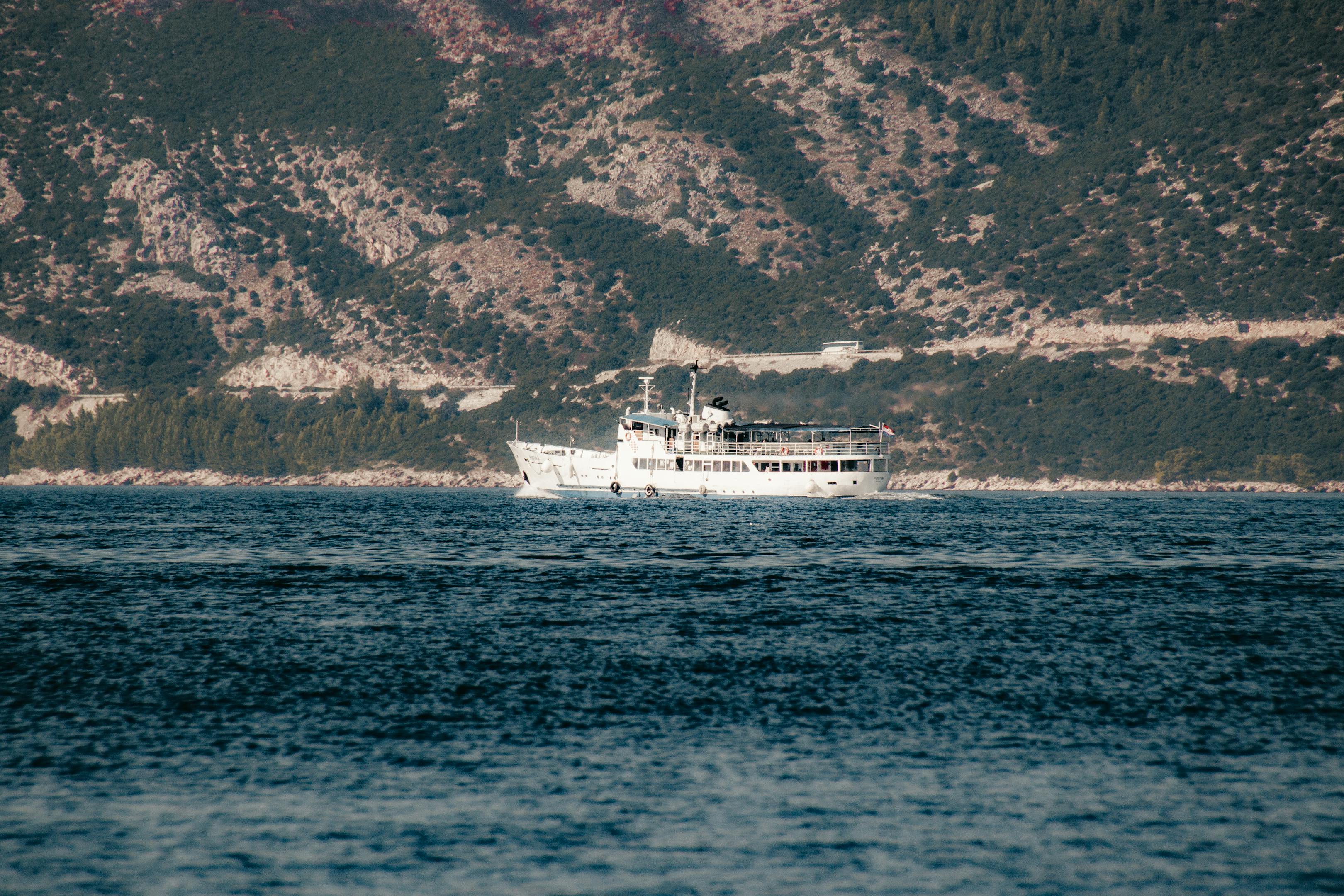 A picturesque ferry cruise along the Adriatic Sea near Croatia's lush coastline