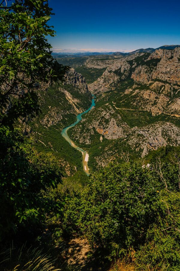 Aerial view of a winding river through rocky mountains in the Gorges du Verdon
