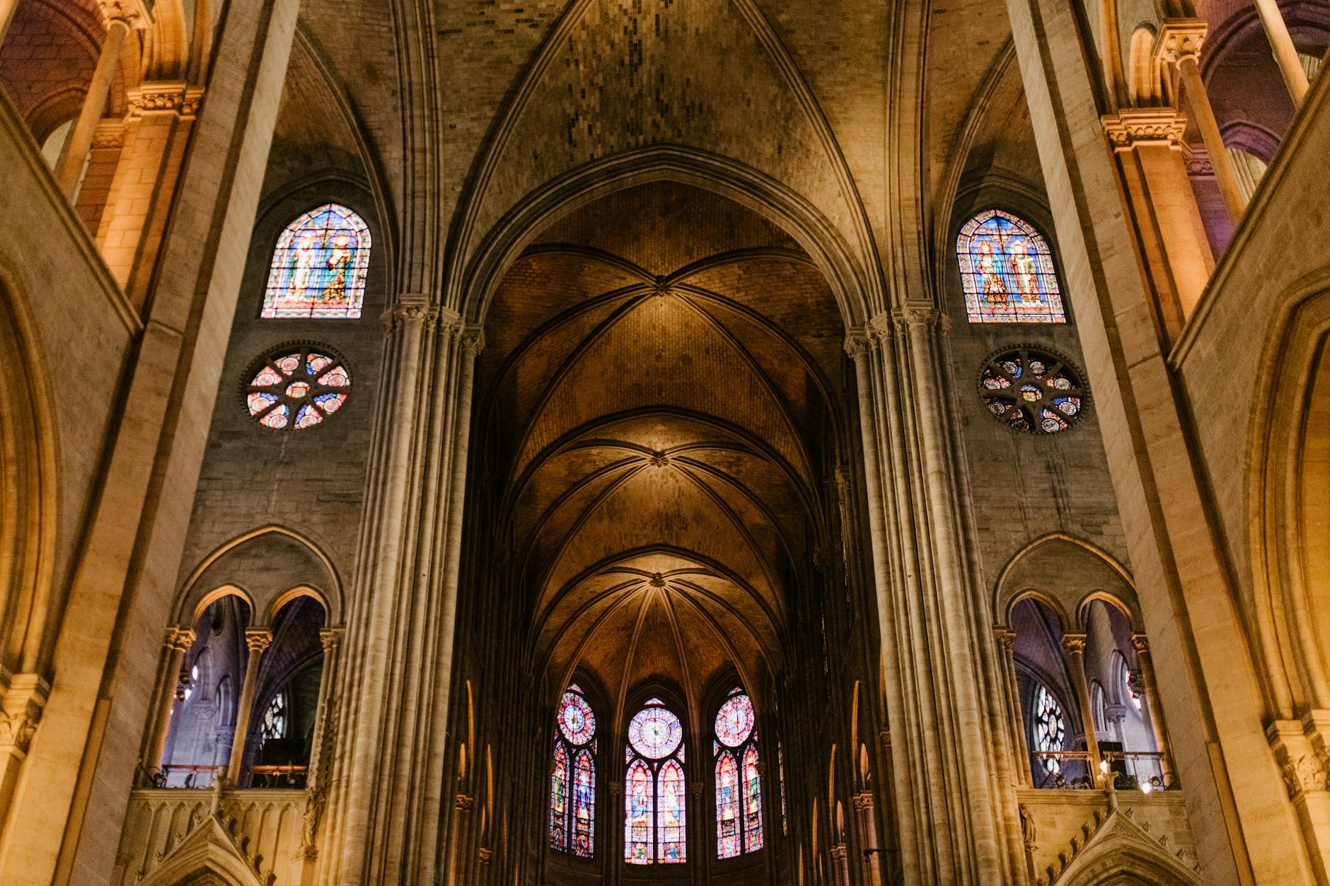 Aged arched ceiling with stained glass detail