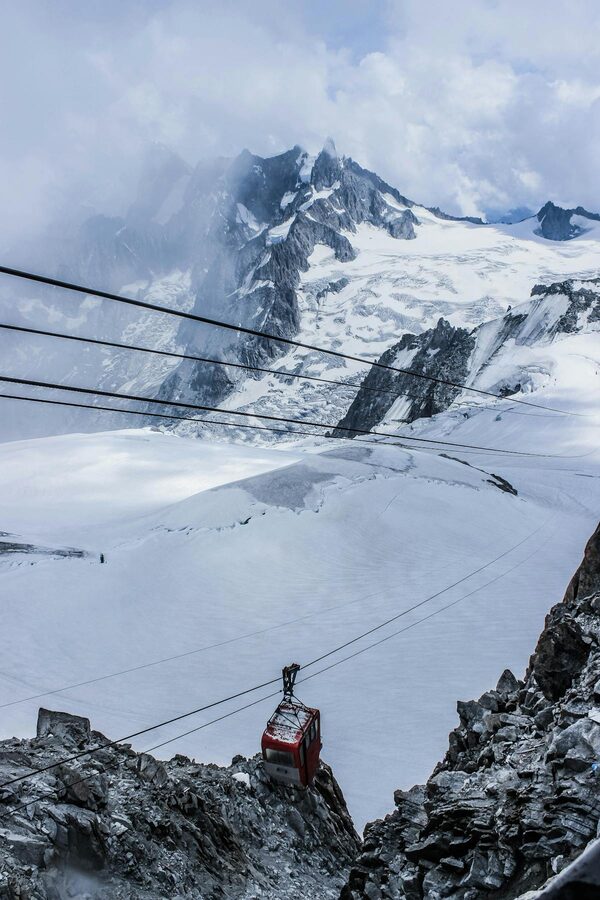 Cable car system ascending in the Alps
