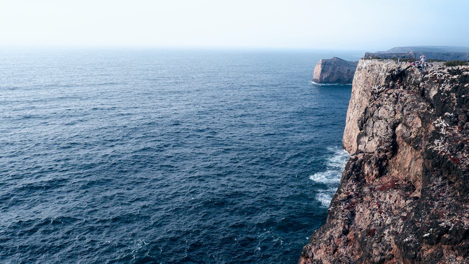 Hidden beach cove between Algarve cliffs