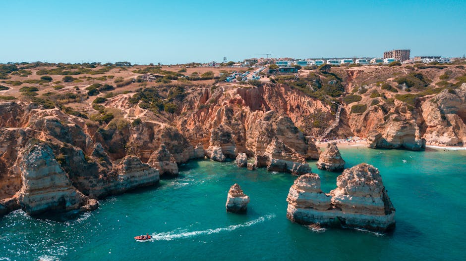 Sea stacks rising from turquoise water along the Algarve coast